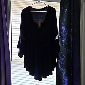 Asymmetrical blouse, 3/4 bell sleeves with lace. Laced front with ribbon